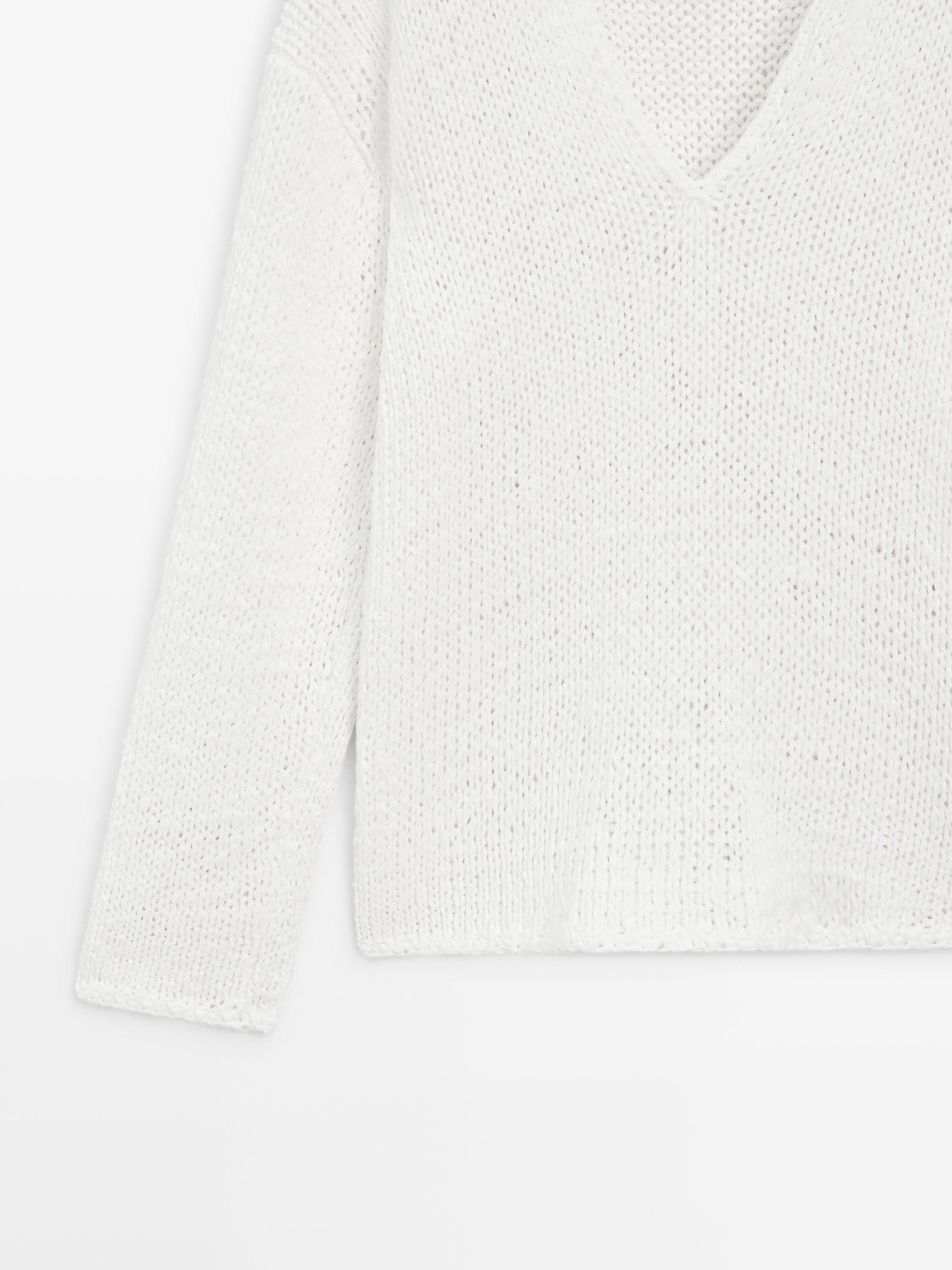 Pull en maille ajourée à col V